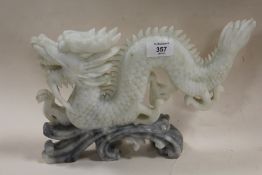 AN ORIENTAL CARVED SOAPSTONE DRAGON