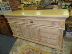 A LARGE MODERN LIMED CABINET WITH MARBLE EFFECT TOP H-92 W-173 CM