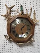 AN ANTLER MOUNTED WALL CLOCK DISPLAY