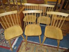 A SET OF FIVE MODERN OAK STICKBACK DINING CHAIRS