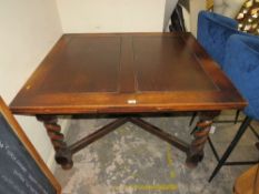 A LARGE OAK BARLEY TWIST DRAWLEAF TABLE