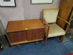 A MID CENTURY TEAK MUSIC CABINET AND ARMCHAIR