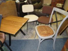 AN INDUSTRIAL STYLE LOW SWIVEL TABLE WITH THREE ASSORTED CHAIRS