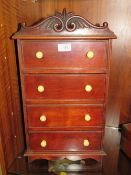 A TABLE TOP / MINIATURE CHEST OF FOUR DRAWERS