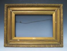 A 19TH CENTURY GOLD WATTS FRAME, with acanthus leaf design to outer edge and gold slip, frame W 8