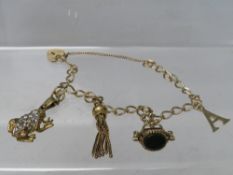 A 9CT GOLD CHARM BRACELET AND CHARMS, some charms unmarked, approximate overall weight 17.8 g
