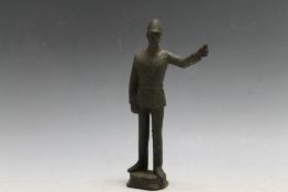 A BRONZE TYPE FIGURE OF A POLICEMAN, H 16.5 cm
