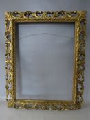 A 19TH CENTURY CARVED WOODEN FLORENTINE GOLD FRAME, frame W 10 cm, rebate 62 x 46 cm