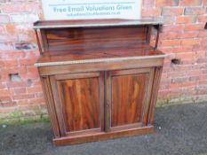 A REGENCY ROSEWOOD CHIFFONIER OF SLIM PROPORTIONS, having gilt brass edging details, two door