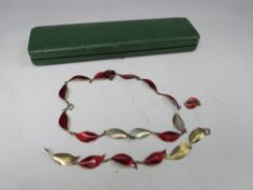 DAVID ANDERSON- A MODERNIST NORWEGIAN SILVER GILT AND ENAMEL JEWELLERY SUITE, comprising a necklace,