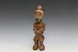 A CARVED WOODEN AFRICAN TRIBAL FIGURE, H 30 cm