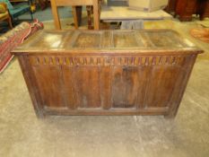 AN 18TH CENTURY OAK PANELLED COFFER, with lozenge carved frieze, H 71 cm, W 136 cm