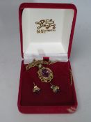 A 9CT GOLD AMETHYST PENDANT, approximately 2.5 g, on an unmarked yellow metal chain, together with a