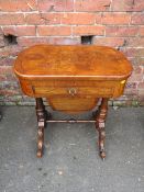 A VICTORIAN WALNUT WORK TABLE, having a hinged top opening to a partially fitted interior above a