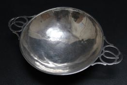 A HALLMARKED SILVER HAMMERED FINISH PIERCED HANDLED DISH - BIRMINGHAM 1945, approx weight 102g,