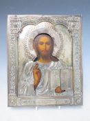 A 19TH CENTURY RUSSIAN ICON WITH WHITE METAL OKLAD, inscribed verso 'To The Spiritual Leader of