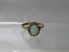 A HALLMARKED 9CT GOLD OPAL AND DIAMOND DRESS RING, hallmarks indistinct, ring size Q ½,