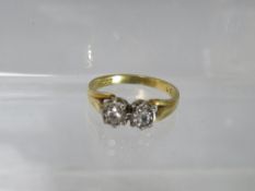 AN 18CT GOLD DRESS RING, with two illusion set diamonds to central crossover type mount, ring size O