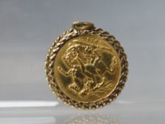 A GOLD GEORGE V FULL SOVEREIGN DATED 1911, set in a decorative pendant mount, approximate weight 9.