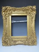 A LATE 18TH / EARLY 19TH CENTURY GOLD SWEPT FRAME, frame W 16 cm, frame rebate 42 x 33 cm