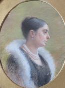 M.B. (XX). An oval portrait study of a lady with a pearl necklace, signed with monogram verso,