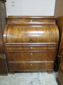 A 19TH CENTURY BIEDERMEIER STYLE MAHOGANY CYLINDER BUREAU HAVING A FITTED INTERIOR, the pull-out