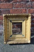 AN 18TH CENTURY CONTINENTAL DECORATIVE GOLD FRAME, with acanthus leaf design to outer edge, frame