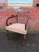 A 19TH CENTURY MAHOGANY ARMCHAIR, with scrolled arms and turned front supports
