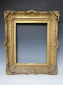A LATE 18TH / EARLY 19TH CENTURY DECORATIVE GOLD SWEPT FRAME, with integral slip, frame W 11 cm,