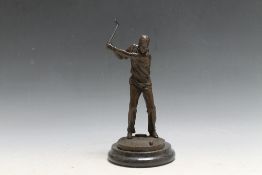 A BRONZE TYPE FIGURE OF A GOLFER, H 25.5 cm