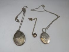 TWO OVAL SILVER PENDANT LOCKETS ON CHAINS, together with a smaller heart shaped example (3)