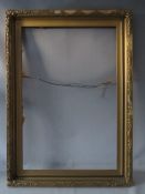 AN EARLY 20TH CENTURY GOLD FRAME WITH LEAF DESIGN TO OUTER EDGE, frame W 8.5 cm, rebate 92 x 61