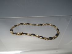 A 9CT GOLD SAPPHIRE AND DIAMOND SET BRACELET, approximately 6.7 g