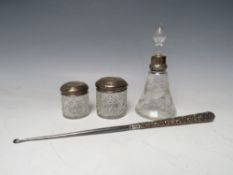 A SILVER COLLARED PERFUME/ VANITY BOTTLE, together with two silver topped vanity jars and an