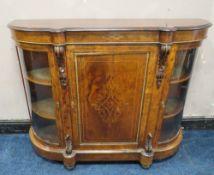 A VICTORIAN WALNUT CREDENZA, having a central inlaid single door flanked by two arched glass