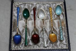 A CASED SET OF SIX HARLEQUIN ENAMEL SILVER GILT COFFEE SPOONS, stamped 'ELa Denmark STERLING 925