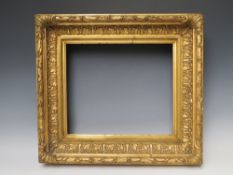 A 19TH CENTURY GOLD FRAME WITH LEAF DESIGN TO INNER EDGE, and acanthus leaf design to outer edge,