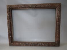 A 19TH CENTURY OAK FRAME WITH CARVED LEAF DESIGN, frame W 7 cm, rebate 50 x 65 cm