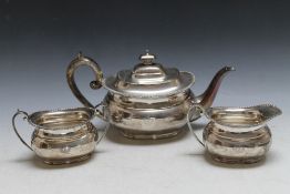 A HALLMARKED SILVER THREE PIECE TEA SERVICE BY HARRISON BROTHERS AN HOWSON - SHEFFIELD 1946, with