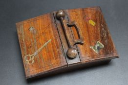 A DOUBLE SIDED LIDDED NEEDLEWORK BOX, painted with sewing implements, W 16.5 cm