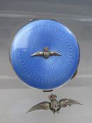 A HALLMARKED SILVER AND GUILLOCHE ENAMEL R.A.F. POWDER COMPACT, together with an RAF silver