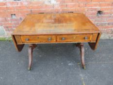 A 19TH CENTURY SOFA TABLE, having inlaid rosewood crossbanding and brass detail, raised on carved