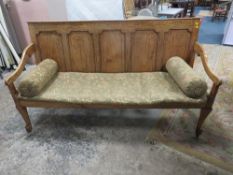 A 19TH CENTURY OAK PANELLED SETTLE, having five panel back, with altered seat, raised on thick