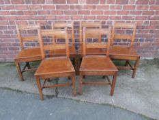 A SET OF SIX 19TH CENTURY OAK PLANK SEAT DINING CHAIRS