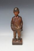 A BLACK FOREST CARVED SOFTWOOD 'WHISTLING FIGURE', circa 1930, in the form of a man with his hands