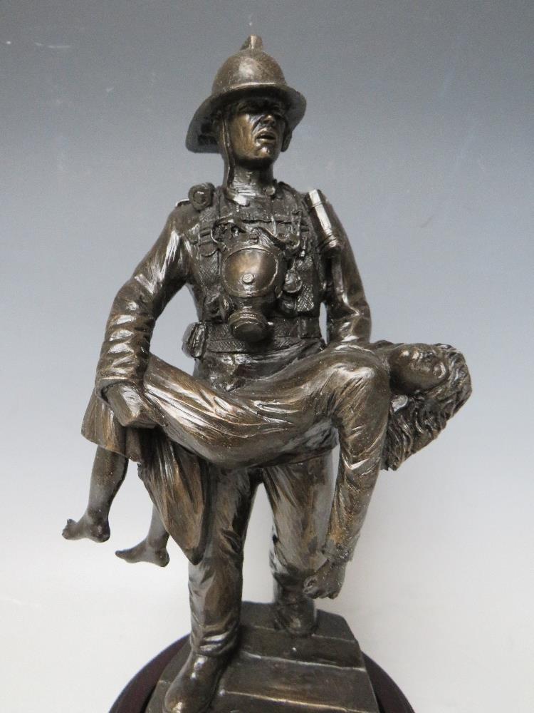 A BALLANTYNES OF WALKERBURN MODERN RESIN FIREMAN WITH CHILD FIGURE - Image 2 of 6