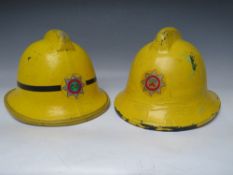 TWO STAFFORDSHIRE CORK BASE FIRE HELMETS, small size dated 1976 and 1985