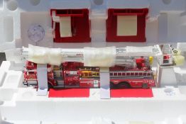 THE FRANKLIN MINT PRECISION MODELS, a boxed Pierce Snorkel 1:32 scale die cast model fire engine,