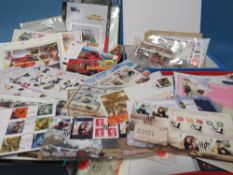 FOUR FOLDERS CONTAINING FIRST DAY COVERS / LOOSE STAMPS, plus Collectors Vehicles catalogues