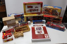 A BOX OF MISCELLANEOUS PLASTIC AND DIE CAST FIRE ENGINES, to include Playart x 2, Promod, etc.